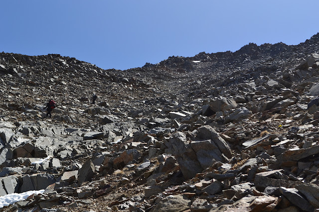 looking up a very steep scree slope