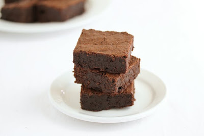 photo of three brownies stacked on a plate