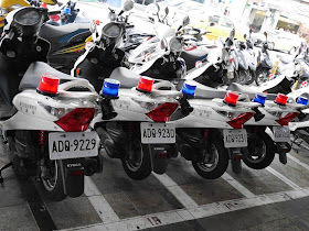 police motorbikes with ascending license plate numbers parked in a row
