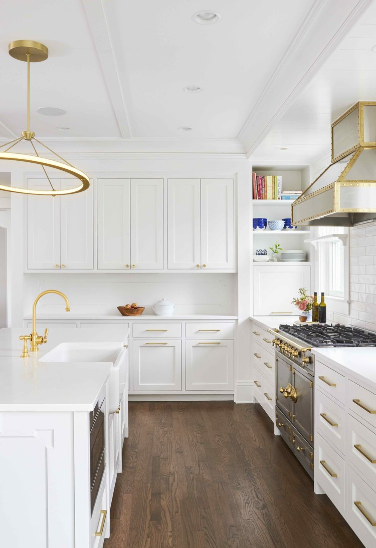 Modern White Kitchen Cabinets With Gold Pulls for Large Space