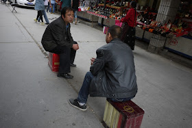 two men having a conversation in Xining, Qinghai, China