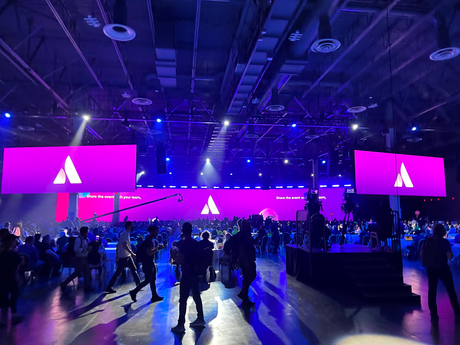 large Atlassian conference hall with bright purple lights