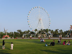 park with large ferris wheel in Zhanjiang, China