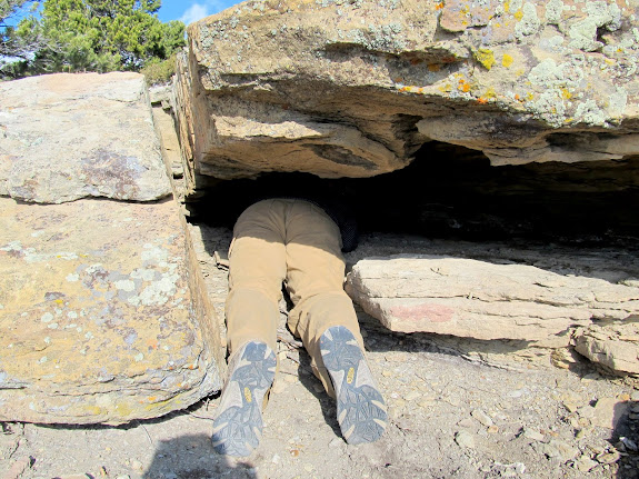 Me crawling under a ledge to retrieve a geocache