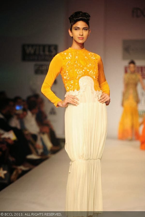 A model walks the ramp for fashion designer Sulakshana on Day 5 of Wills Lifestyle India Fashion Week (WIFW) Spring/Summer 2014, held in Delhi.