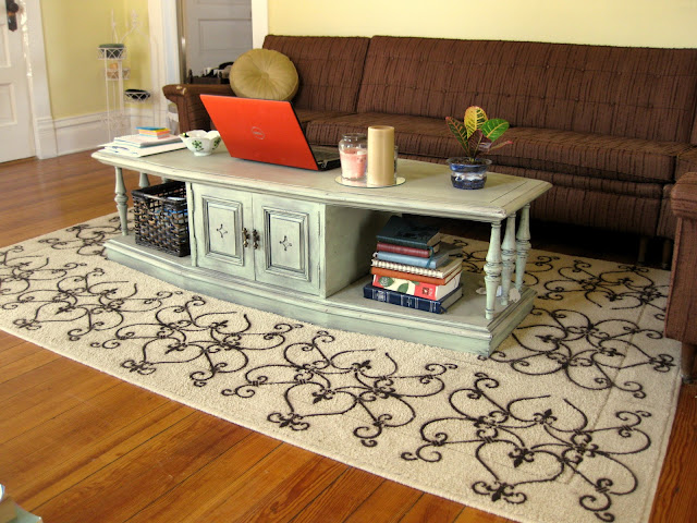 With the coffee table in the center of the rug, the newly finished DIY stencil patterns looks amazing and matching the design of the room!