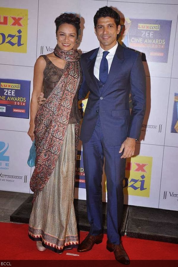 Bollywood actor Farhan Akhtar and his wife Adhuna Akthar pose for the shutterbugs as they walk the red carpet at the Zee Cine Awards 2014, held at Filmcity, in Mumbai, on February 08, 2014. (Pic: Viral Bhayani) Bollywood actor Farhan Akhtar and his wife Adhuna Akthar pose for the shutterbugs as they walk the red carpet at the Zee Cine Awards 2014, held at Filmcity, in Mumbai, on February 08, 2014. (Pic: Viral Bhayani)