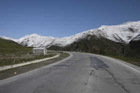 road scene with snow covered mountains in Qinghai, China