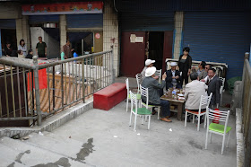 men drinking tea outside in Xining, Qinghai, China