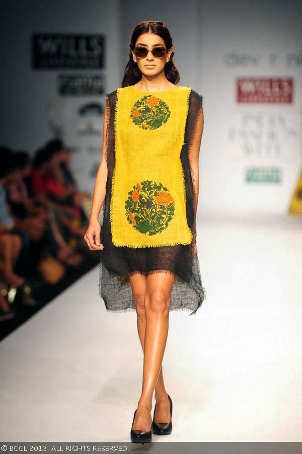 A model showcases a creation by fashion designers Dev r Nil on Day 3 of Wills Lifestyle India Fashion Week (WIFW) Spring/Summer 2014, held in Delhi.