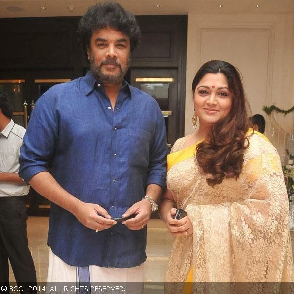 Sundar C and Khushboo pose as they arrive for the wedding reception party of T Rajendar's daughter Elakkiya with Abhilash, held at The Leela Palace in Chennai.