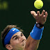 Rafael Nadal of Spain serves the ball to Denis Germelmayr of Germany during their ATP Qatar Open tennis match at the Khalifa Tennis and Squash Complex in Doha on January 4, 2012. AFP PHOTO/KARIM JAAFAR (Photo credit should read KARIM JAAFAR/AFP/Getty Images)