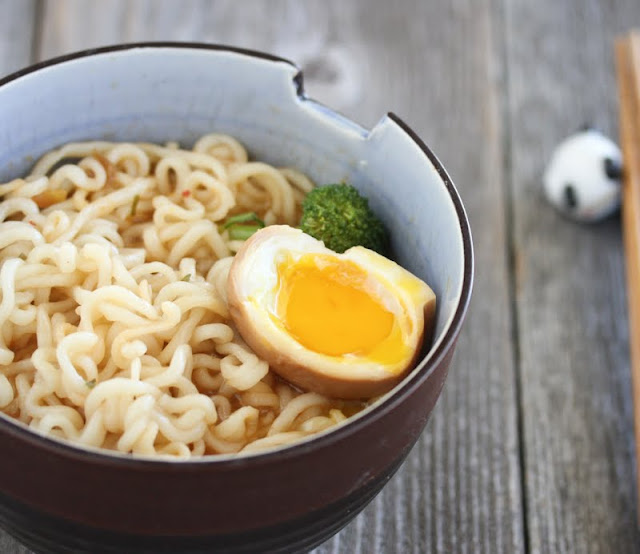 close-up photo of a Japanese Marinated Soft Boiled Egg in a bowl of ramen