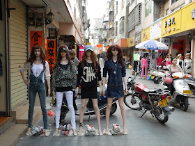 mannequins next to a motorbike in Yangjiang, China