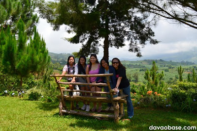 Female bloggers posing on a breathtaking scenery of Kapatagan, from inside Camp@Tagan Hillside