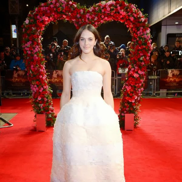 Jessica Brown Findlay arrives on the red carpet for A New York Winter's Tale UK Premiere at the Odeon Kensington on Thursday, Feb. 13, 2014, in London.