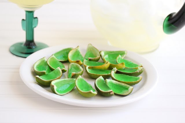photo of Margarita Jello Shots on a plate with a glass and pitcher in the background