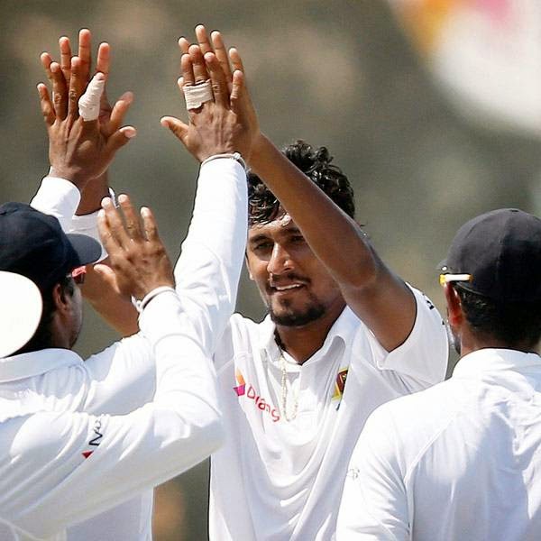 Sri Lanka's Suranga Lakmal (C) celebrates with teammates after taking the wicket of South Africa's Dale Steyn (not pictured) during the second day of their first test cricket match in Galle July 17, 2014. 