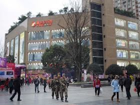 Three male People's Armed Police at a shopping street in Dadukou, Chongqing