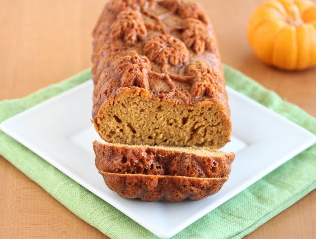 photo of a pumpkin loaf with two slices