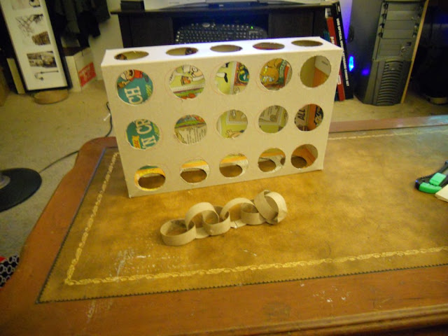 vertical view of peek a prize cardboard toy box