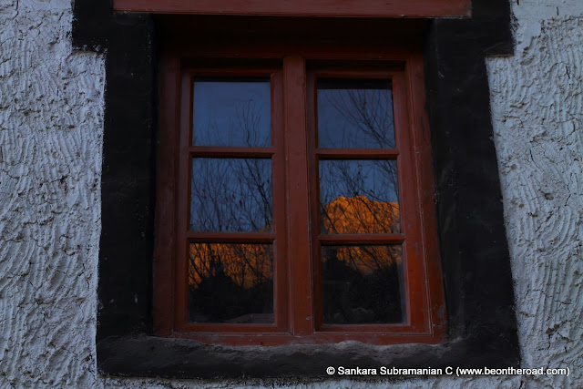 Reflection of the Himalayan mountains on the Hemis Monastery window
