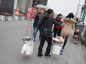 woman carrying supplies to make food