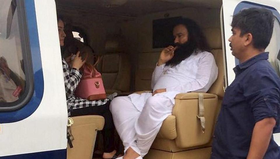 Dera Sacha Sauda chief Gurmeet Ram Rahim in a helicopter in which he was flown from Panchkula to Rohtak town on Friday.