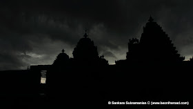 Silhouette of the Lakshmi Devi Temple against the dark monsoon skies at Doddagaddavalli
