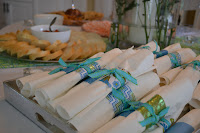 These napkins wrapped with turquoise ribbon add to the party's theme. 