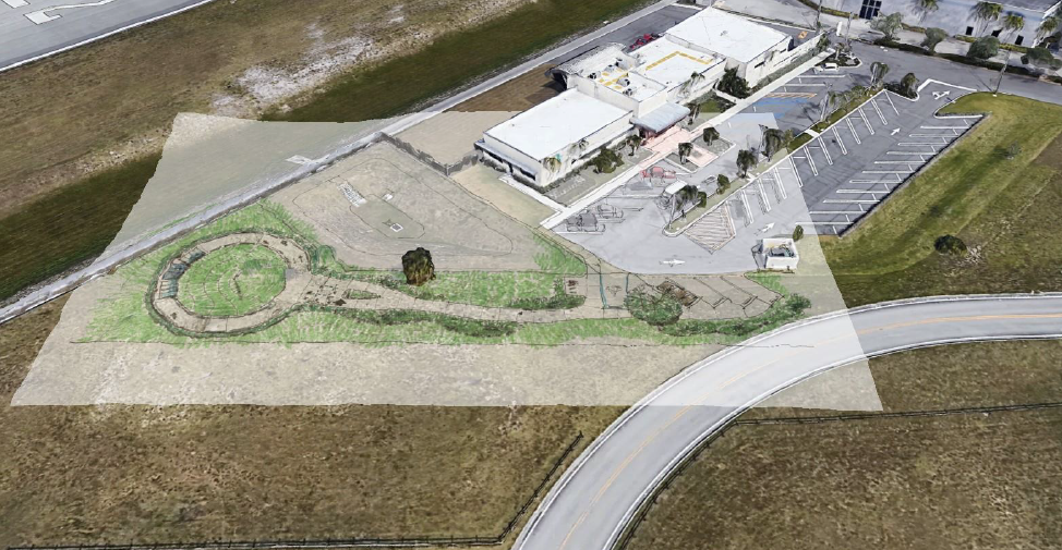 Aerial view of a building and a road

Description automatically generated