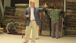 Notice all the rugs behind him folded up - most of those ended up unrolled for our viewing Notice all the rugs behind him folded up - most of those ended up unrolled for our viewing