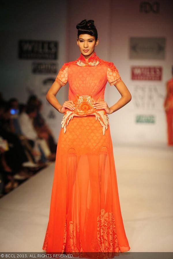 A model displays a creation by fashion designer Sulakshana on Day 5 of Wills Lifestyle India Fashion Week (WIFW) Spring/Summer 2014, held in Delhi.<br /> 