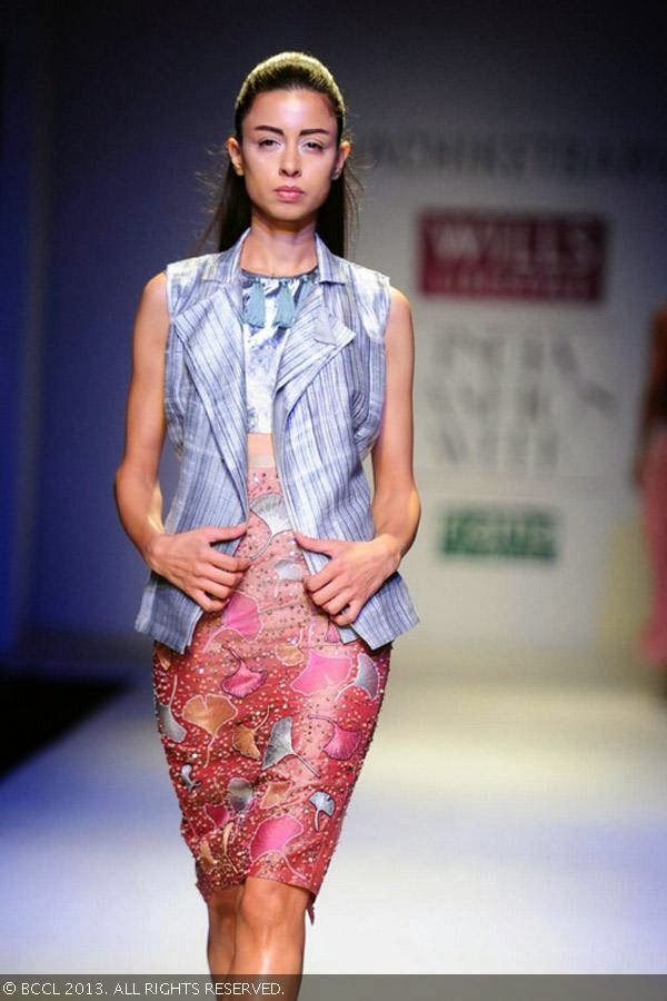 Sapna showcases a creation by fashion designer Nachiket Barve on Day 1 of Wills Lifestyle India Fashion Week (WIFW) Spring/Summer 2014, held in Delhi.