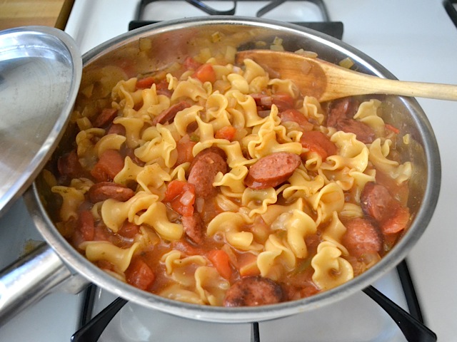 cooked pasta and sausage in skillet 