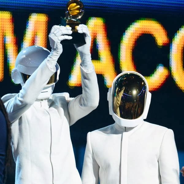 Winners for Best Record Of The Year 'Get Lucky' Daft Punk celebrate their award on stage for the 56th Grammy Awards at the Staples Center in Los Angeles, California.