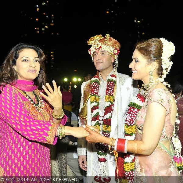 Actress Juhi Chawla greets Raageshwari Loomba and Sudhanshu Swaroop during their wedding, held in Mumbai, on January 27, 2014.