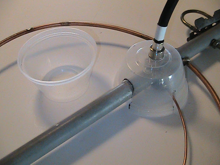 A
                      similar weather shield was placed on the lower
                      halo antenna. The spaces in and around the mating
                      surfaces of all the connectors were filled with
                      petroleum jelly and the connectors wrapped with
                      self-sealing silicone tape.
