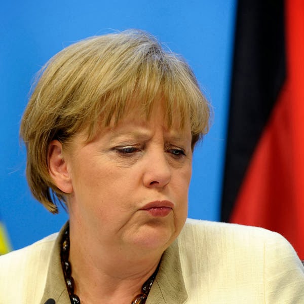 Angela Merkel speaks during a news conference at the European Council building at the end of an euro zone leaders crisis summit in Brussels.