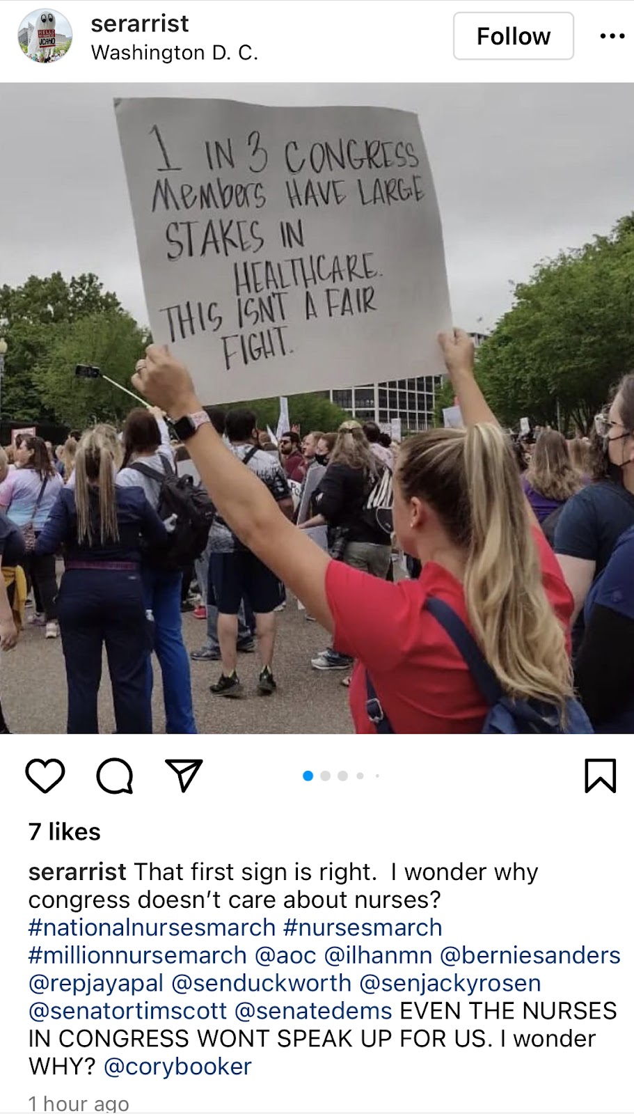 Girl hold sign that reads "1 in 3 congress members have large stakes in healthcare. This isn't a fair fight."