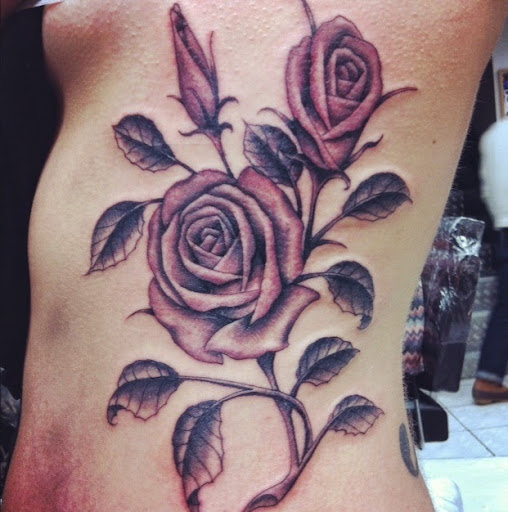 rose tattoos on ribs