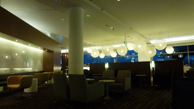 Inside the Qantas International Business Lounge, Sydney Airport, seating and lights