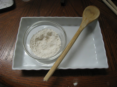 Dip tip of wooden spoon in flour before poking a hole in cookie dough to avoid sticking