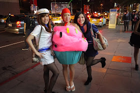 young women wearing cupcake and sailor costumes for Halloween in Taipei, Taiwan