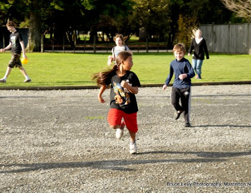 Children running at back of church