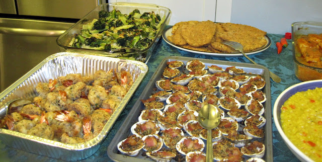 top left to right: baked broccoli with red pepper flakes and garlic, baked flounder, dried cod in tomato sauce, baked shrimp, baked clams, risotto with saffron, etc.