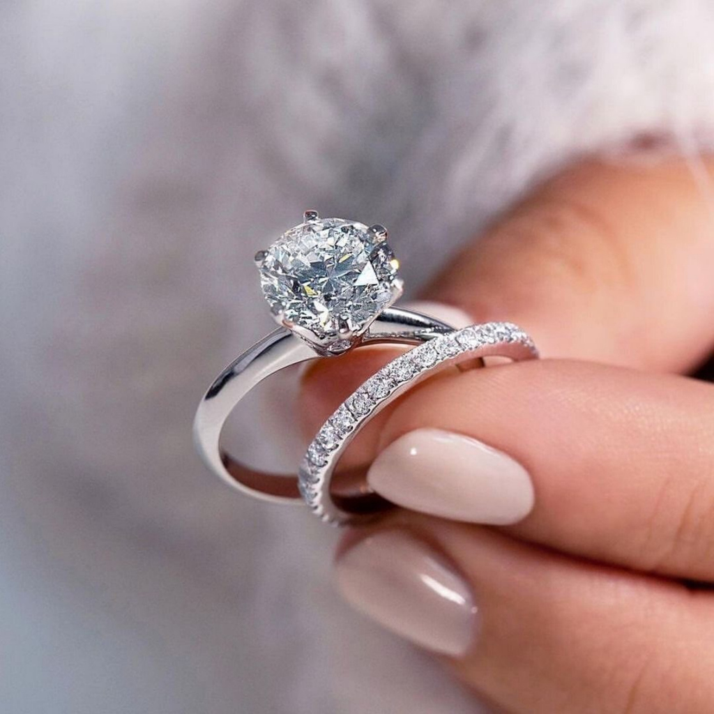 Hand showcasing a sparkling diamond engagement ring