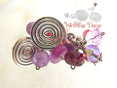 Wire wrapped Cluster earrings with mixture of purple or near purple gemstones and crystals