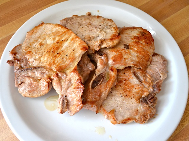 cooked pork chops on plate 
