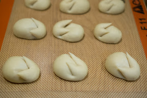 step by step photo showing bunny buns ready to be baked